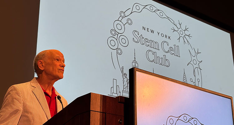 Dr. Nestler at podium on stage